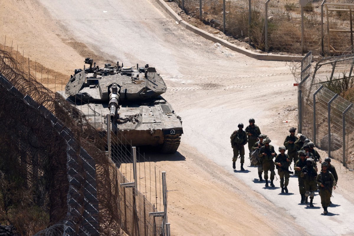 Israeli troops patrol the border fence with Syria near the Druze village of Majdal Shams in the Israel-annexed Golan Heights on July 23, 2025. (File/AFP)