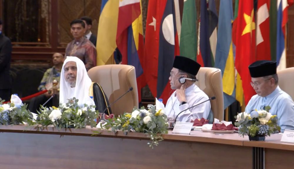 Muslim World League Secretary-General Dr. Mohammed bin Abdulkarim Al-Issa, left, and Malaysian PM Anwar Ibrahim take part in the International Summit of Religious Leaders in Kuala Lumpur, Malaysia, Aug. 28, 2025. (Department of Islamic Development Malaysia)