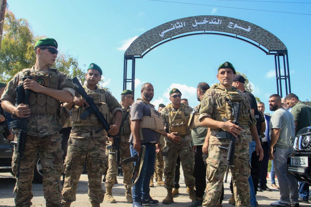 Lebanese soldiers stand guard outside an army base in the southern city of Tyre, Aug. 28, 2025. (AFP)