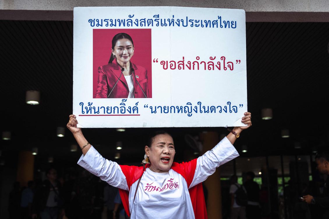 A supporter of Thailand’s sacked prime minister Paetongtarn Shinawatra reacts after the ruling on her dismissal by the Constitutional Court in Bangkok on Aug. 29, 2025. (AFP)