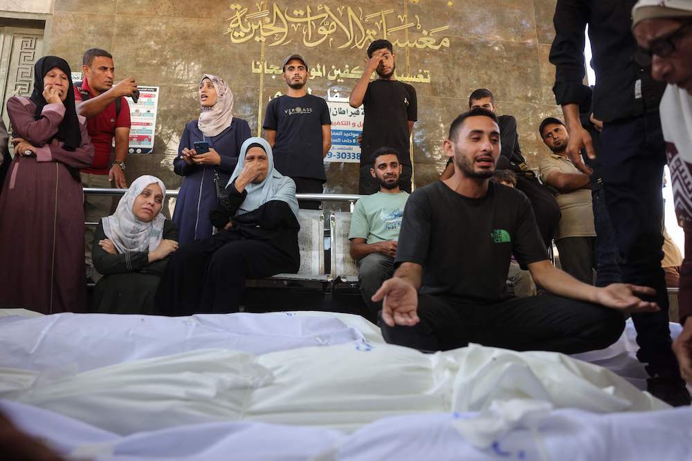 Palestinians mourn outside Shifa hospital in Gaza City where casualties of Israeli fire were transported ahead of their funerals on Aug. 29, 2025. ( AFP)