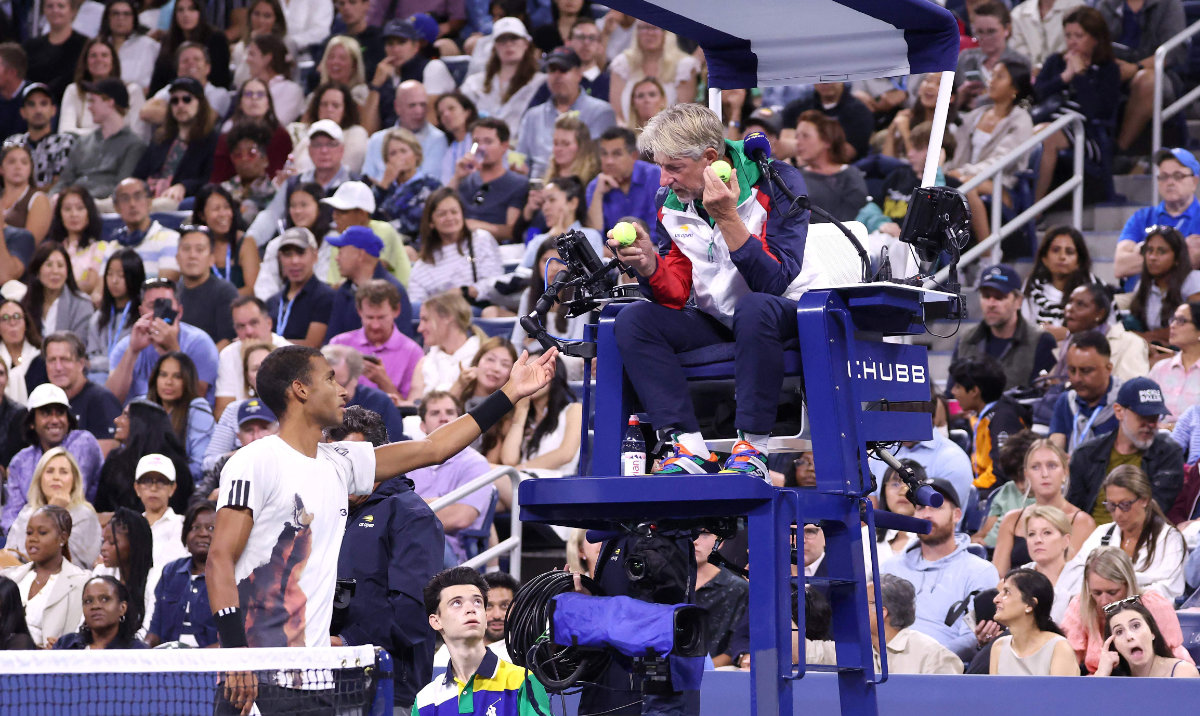 Felix Auger-Aliassime of Canada talks with the chair umpire during his Men's Singles Third Round match against Alexander Zverev of Germany on Day Seven of the 2025 US Open at USTA Billie Jean King National Tennis Center on August 30, 2025 in the Flushing neighborhood of the Queens borough of New York City. (AFP)
