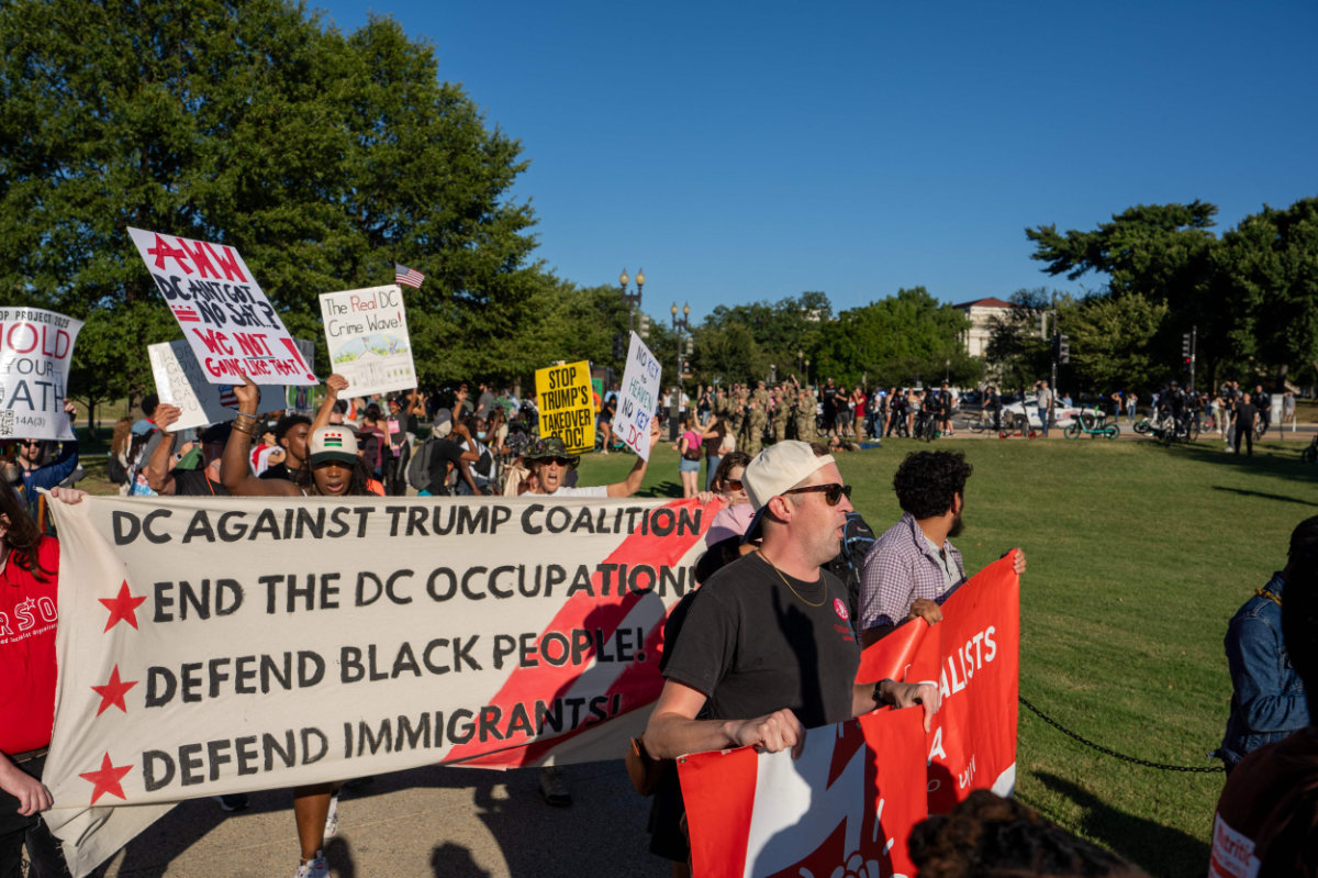 Protesters march in Washington, D.C., to protest the Trump administration's deployment of federal officers and the National Guard on the pretext of helping local police in crime prevention in the nation's capital. (Getty Images via AFP)