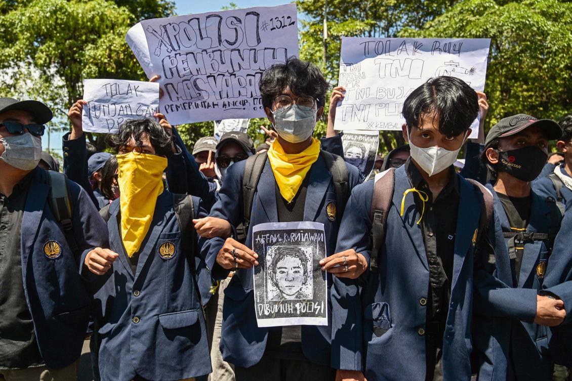 Viral footage of a tactical van crashing into a young delivery driver in Indonesia’s capital before rolling over his body has sparked renewed anger against a police force.(AFP)