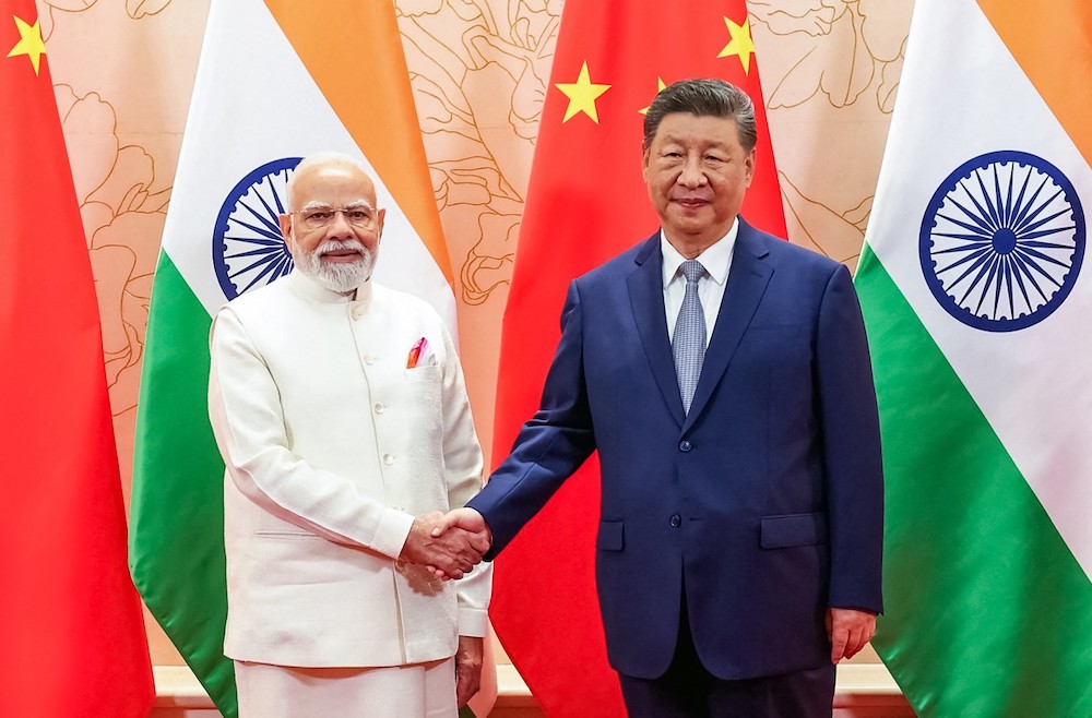 Indian PM Narendra Modi and Chinese President Xi Jinping shake hands during a bilateral meeting on the sidelines of the Shanghai Cooperation Organization summit in Tianjin on Aug. 31, 2025. (Indian Press Information Bureau/AFP)