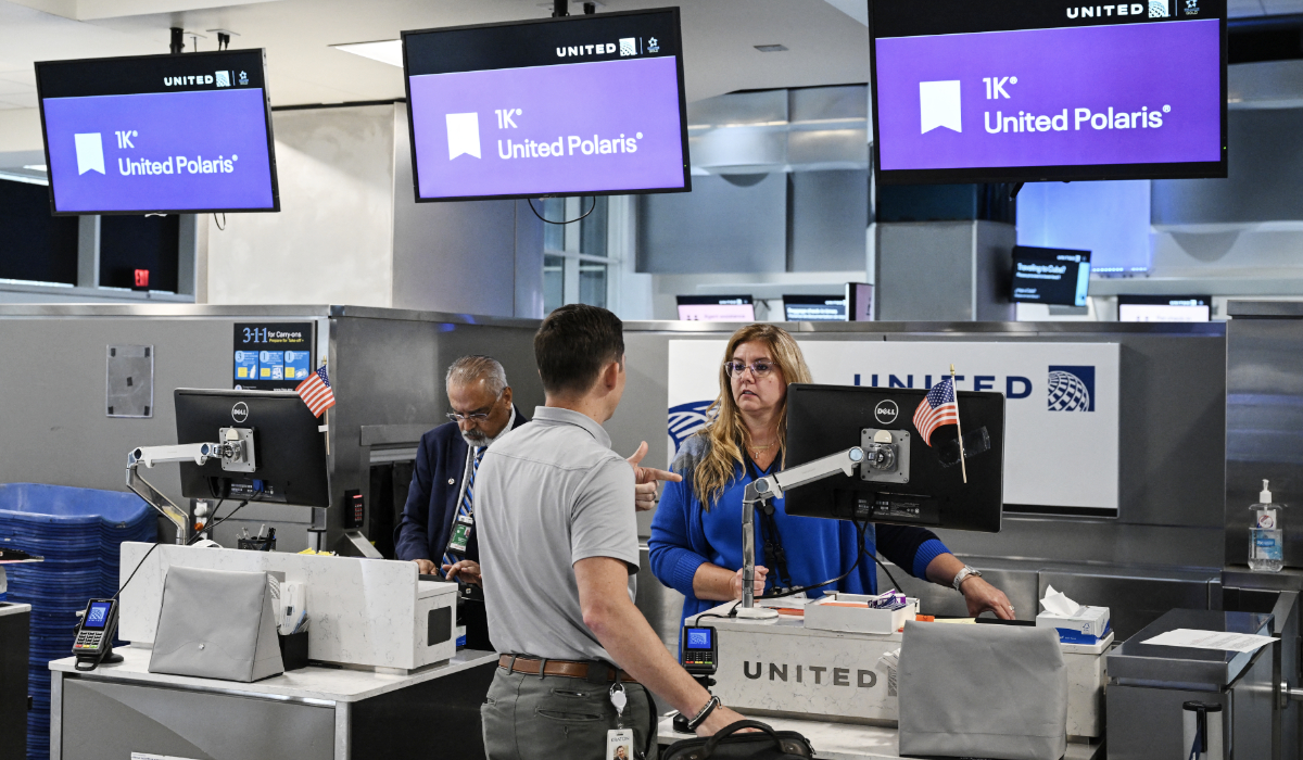 Passengers and employees of United Airlines are seen at George Bush Intercontinental Airport on July 25, 2025, in Houston, Texas. (AFP)