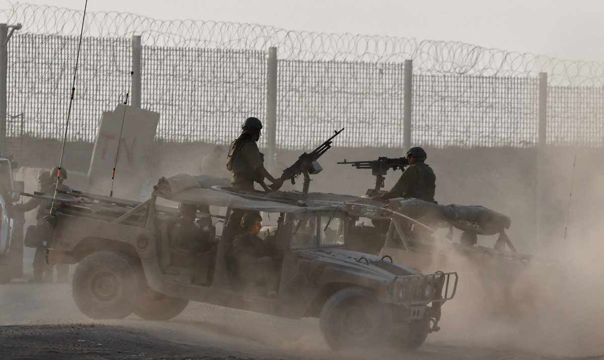 Israeli military vehicles operate, near the Israel-Gaza border, in Israel, August 16, 2025. (Reuters)