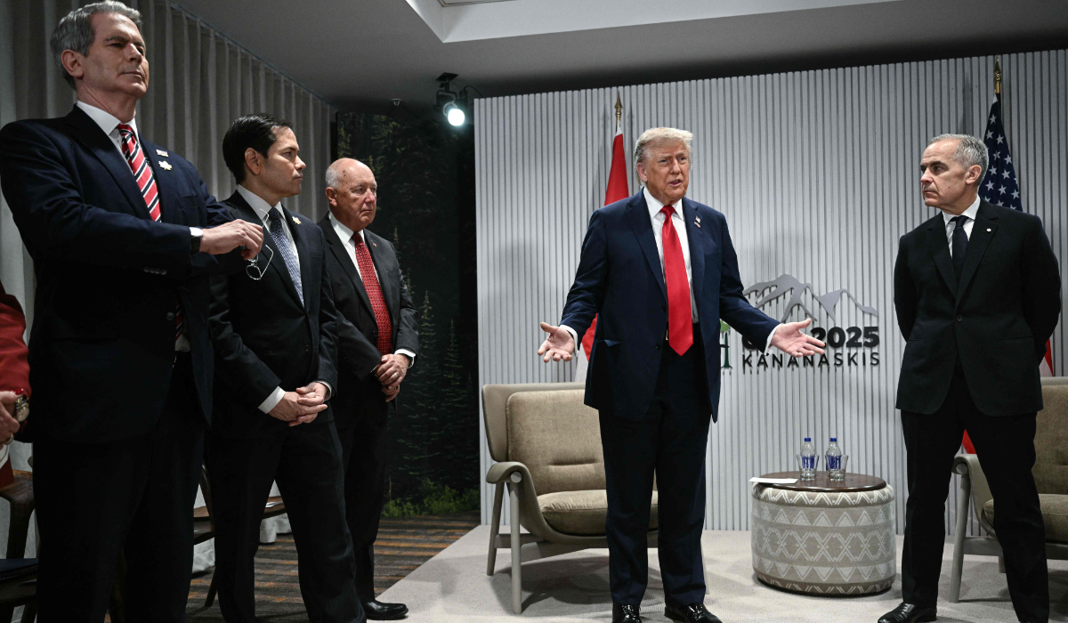 President Trump speaks as Canadian PM Mark Carney (R) looks on as they meet during the G7 Summit in Alberta. (AFP)