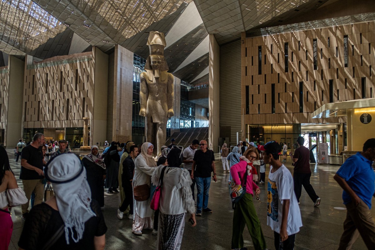 Visitors tour the Grand Egyptian Museum in Giza on the southwestern outskirts of Cairo on May 5, 2025. (AFP)