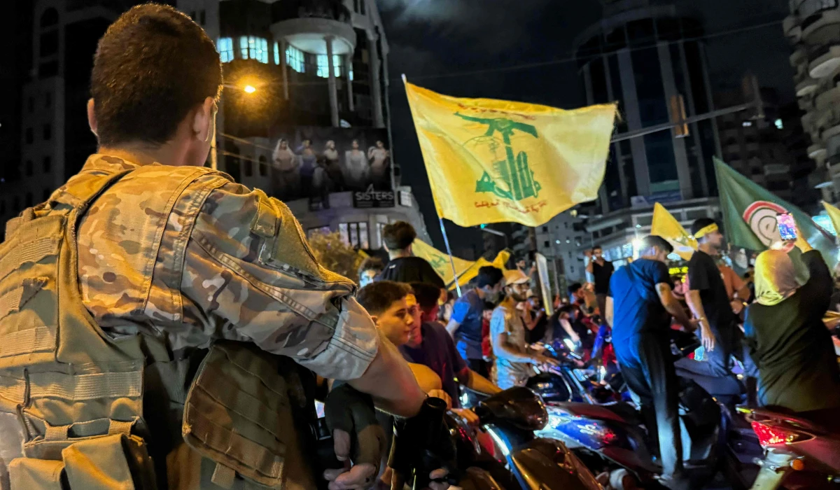 Supporters of Lebanon's militant group protest in Beirut against the government's endorsement of a disarmament plan. (AFP)