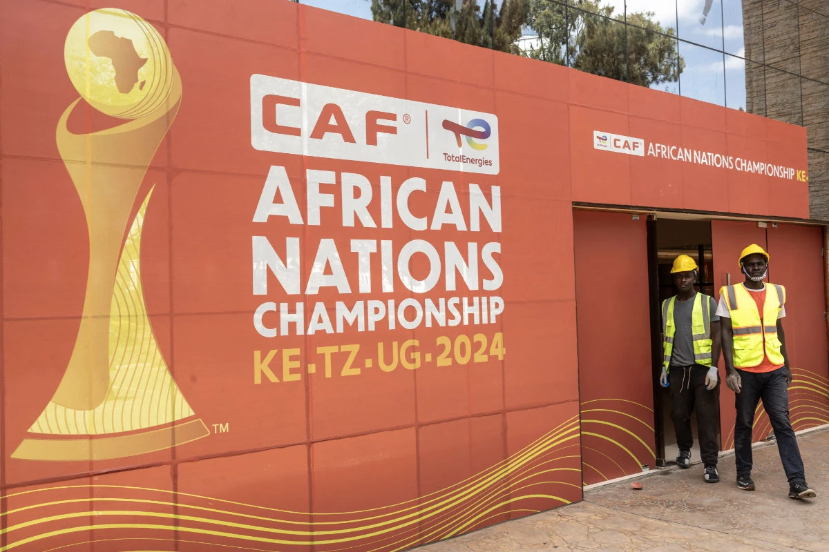 Construction workers exit the main gate at the Nyayo national stadium VIP entrance, in Nairobi on July 28, 2025, ahead of the CAF African Nations Championship 2024. (AFP)
