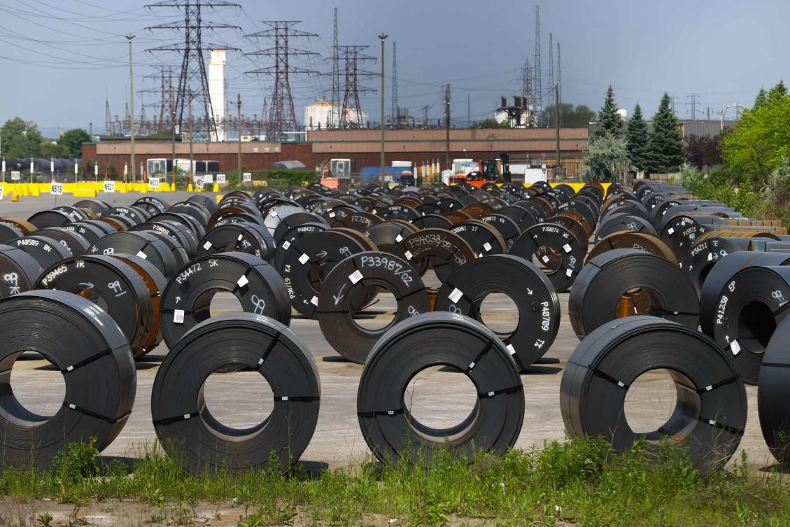 Coils of steel are seen in a yard outside one of ArcelorMittal Dofasco’s steel manufacturing buildings in Hamilton, Ontario. Canada’s lumber, steel, aluminum and automobiles sectors are more those heavily impacted by US duties and tariffs. (AFP)