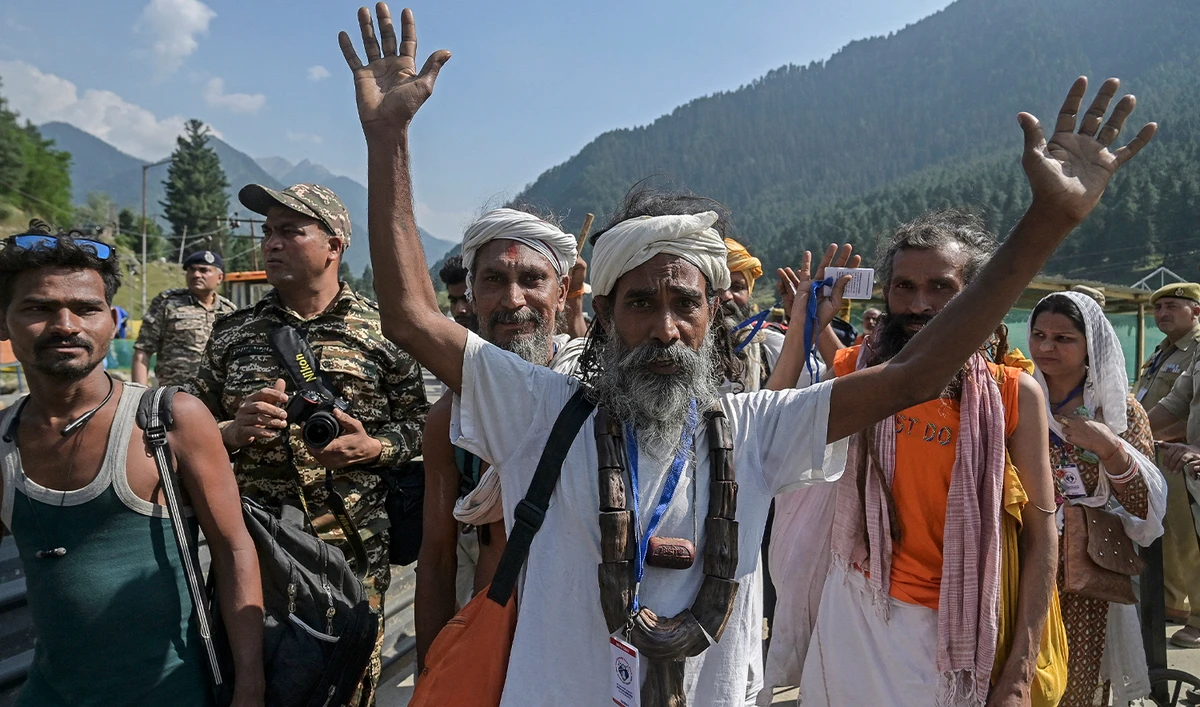 Hindu pilgrims gesture as they begin their pilgrimage to the cave shrine of Amarnath from a base camp in Pahalgam on June 28, 2024. (AFP/File)