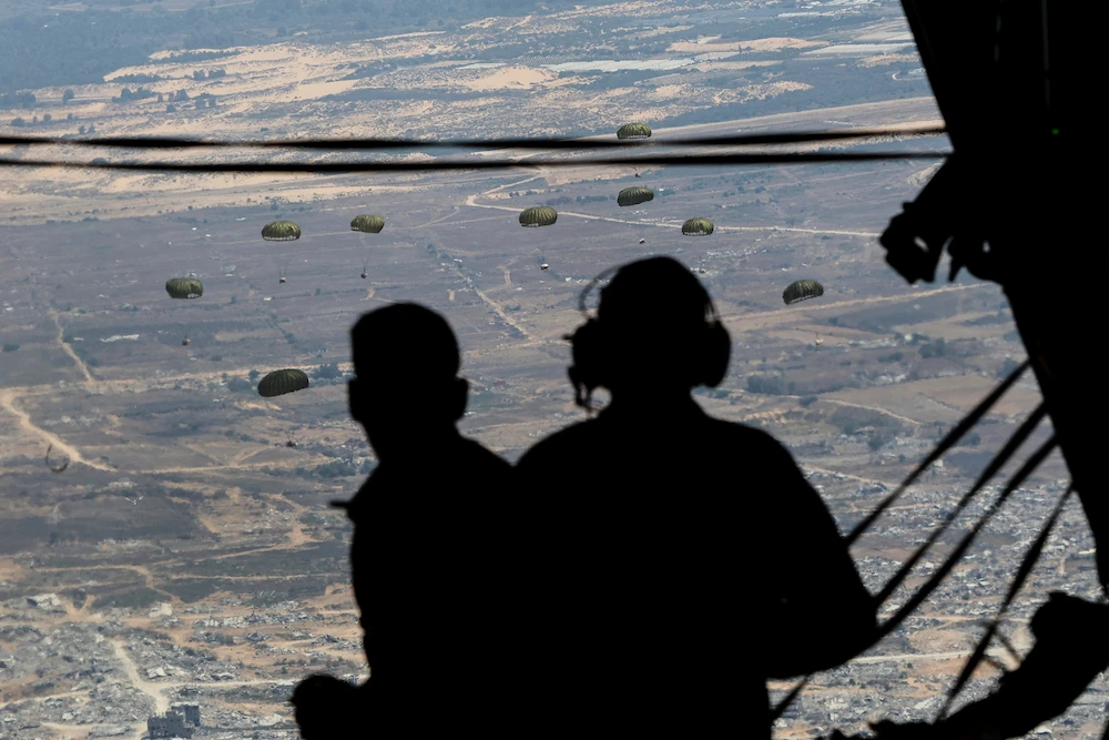 Containers of humanitarian aid are airdropped to Palestinians in the Gaza Strip. (AP)