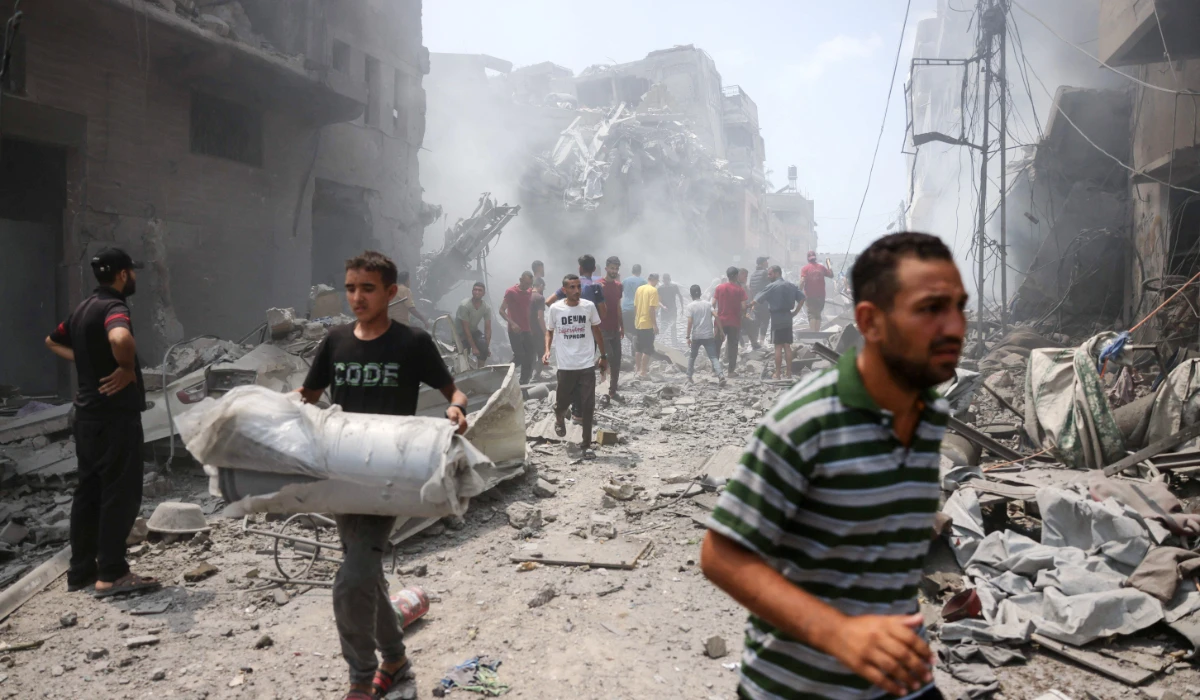 Palestinians check the devastation following an Israeli strike that hit Gaza City's southern al-Zeitoun neighbourhood on August 8, 2025. (AFP)
