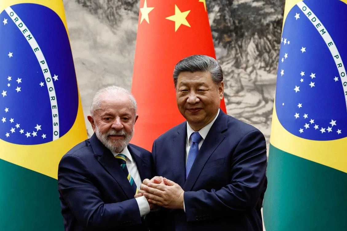Chinese President Xi Jinping, right, with Brazil’s President Luiz Inacio Lula da Silva at the Great Hall of the People in Beijing on May 13, 2025. (AFP)
