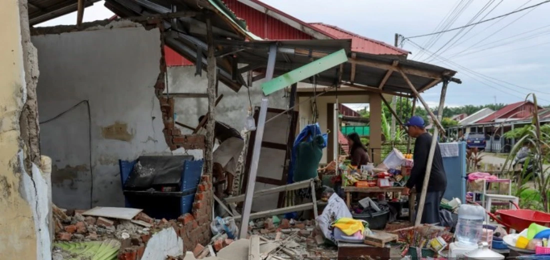Residents search for valuables from the rubble of their damaged homes by the 6.3 magnitude earthquake that took place in May 2025 at Bengkulu Province, Indonesia.