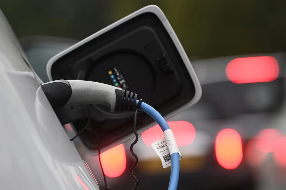 Electric vehicle sales growth eases to 21% in July, research firm says