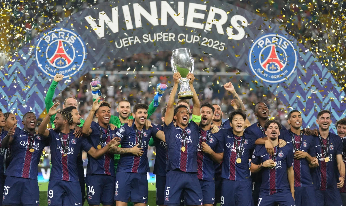 PSG’s captain Marquinhos lifts the trophy with teammates after the UEFA Super Cup match between Paris Saint-Germain and Tottenham Hotspur in Udine, Italy, Wednesday. (AP)