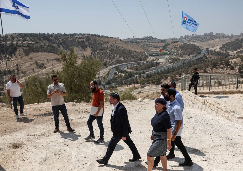 Israeli Finance Minister Bezalel Smotrich walks to attend a press conference regarding settlements expansion for the long-frozen E1 settlement. (Reuters)