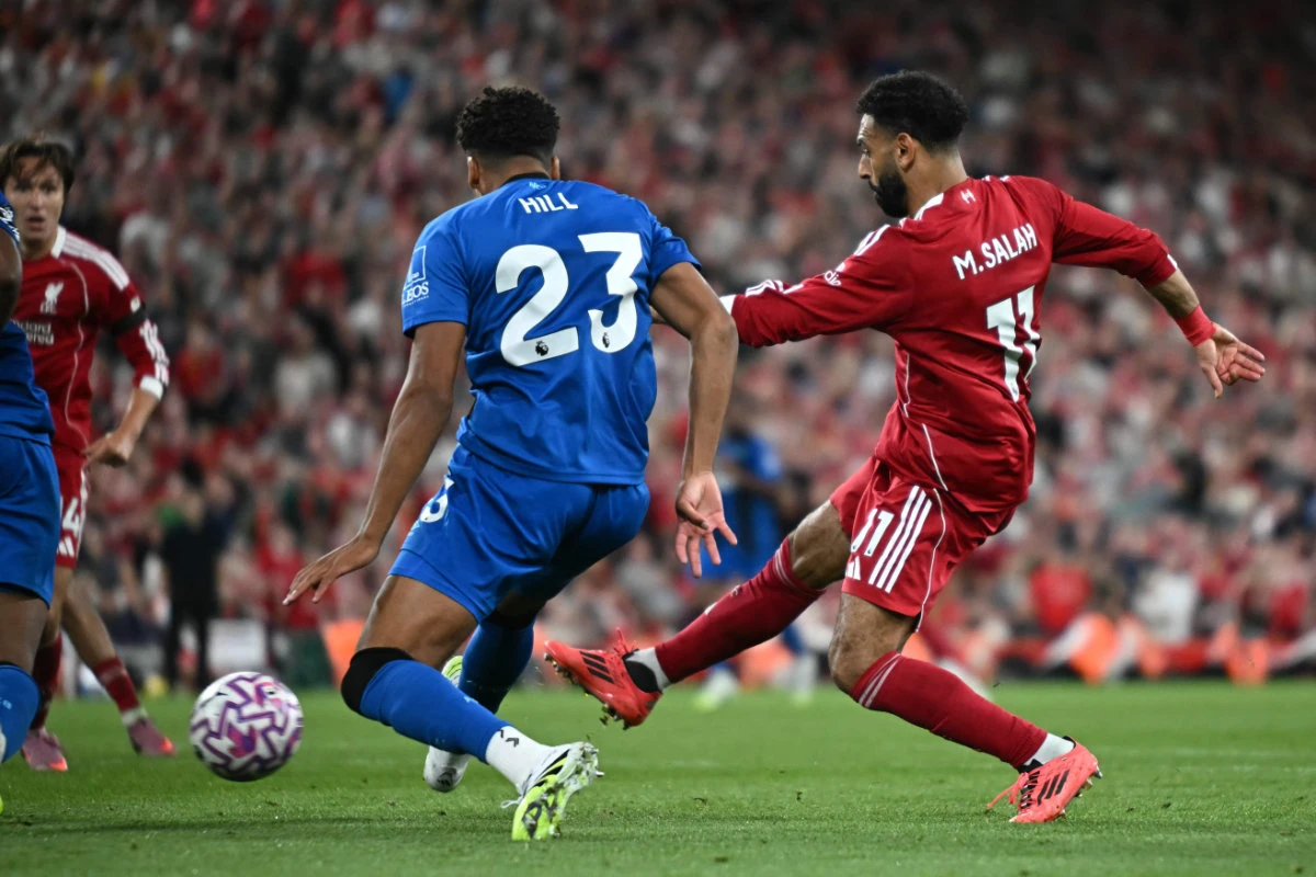 Liverpool’s Egyptian striker Mohamed Salah (R) scores their fourth goal during the English Premier League football match between Liverpool and Bournemouth at Anfield in Liverpool, north west England on Friday. (AFP)