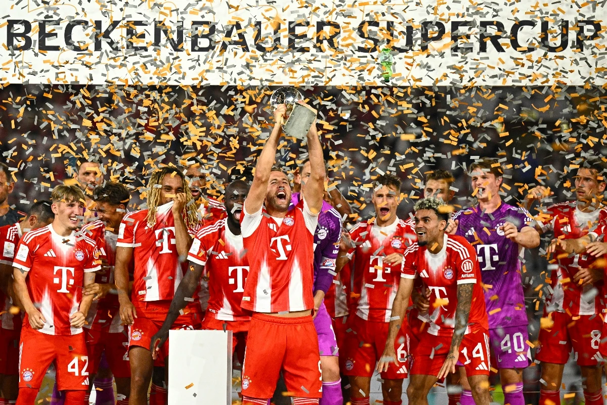 Bayern’s Harry Kane celebrates with teammates after winning the German Supercup final between VfB Stuttgart and Bayern Munich in Stuttgart Saturday. (Tom Weller/dpa via AP)