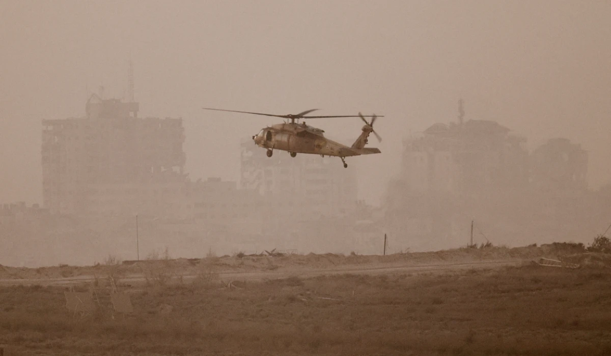 An Israeli blackhawk evacuation helicopter flies over Gaza, as seen from the Israeli side of the border, Israel August 18, 2025. (REUTERS)