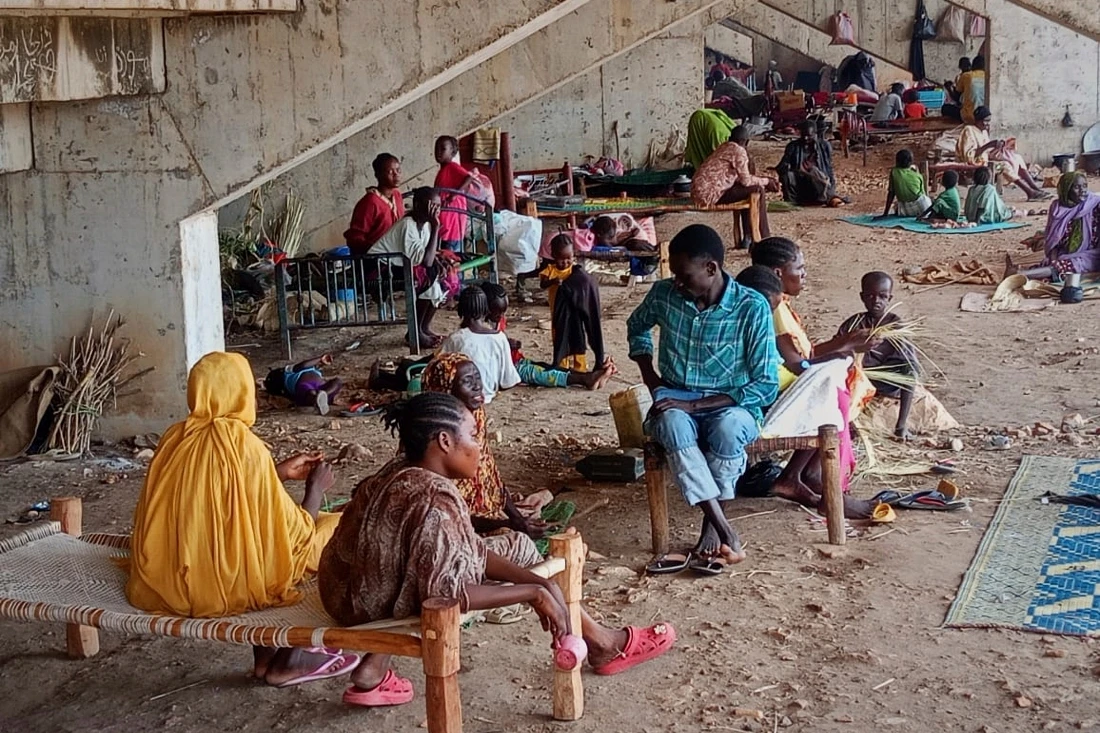 Sudanese families displaced by RSF attacks in Kordofan take shelter in a football stadium in Kadugli, South Kordofan province, Sudan. (AP)