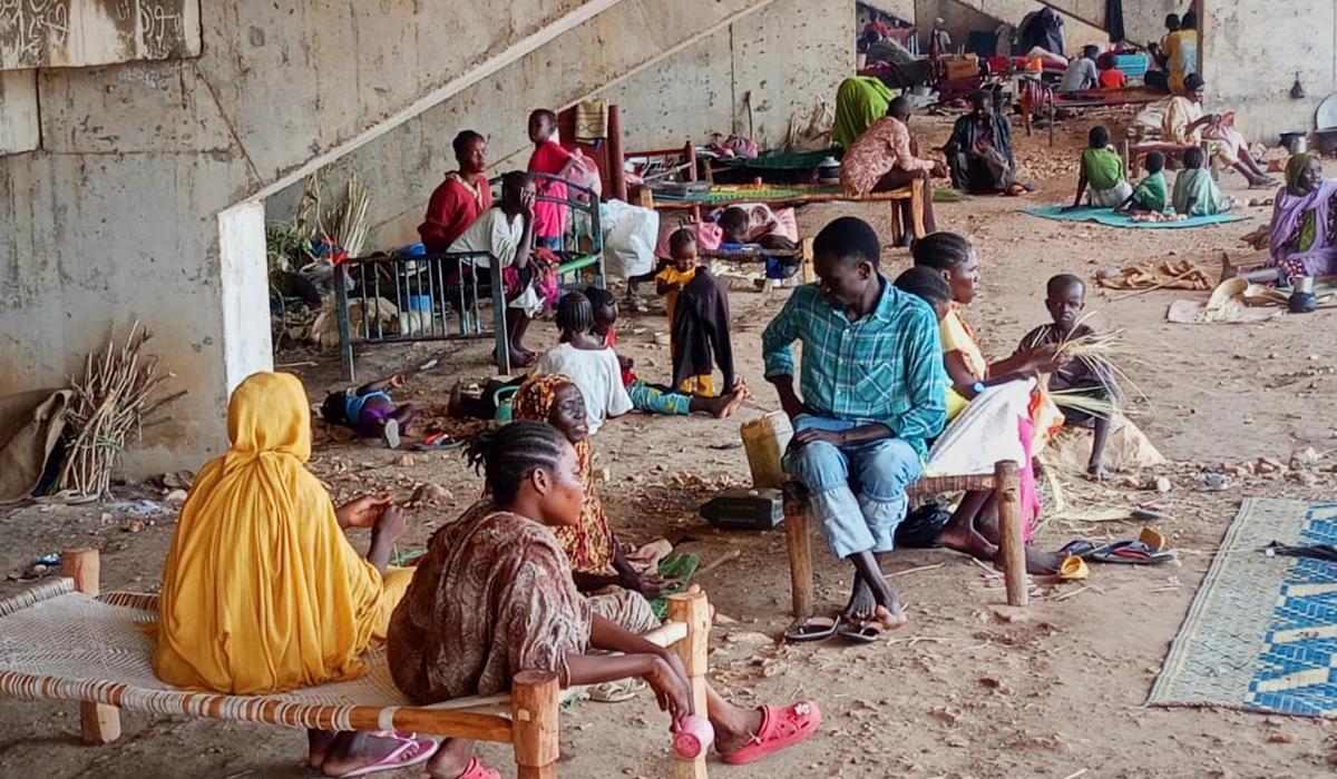 Displaced Sudanese families take shelter in a football stadium in South Kordofan province. (AP)