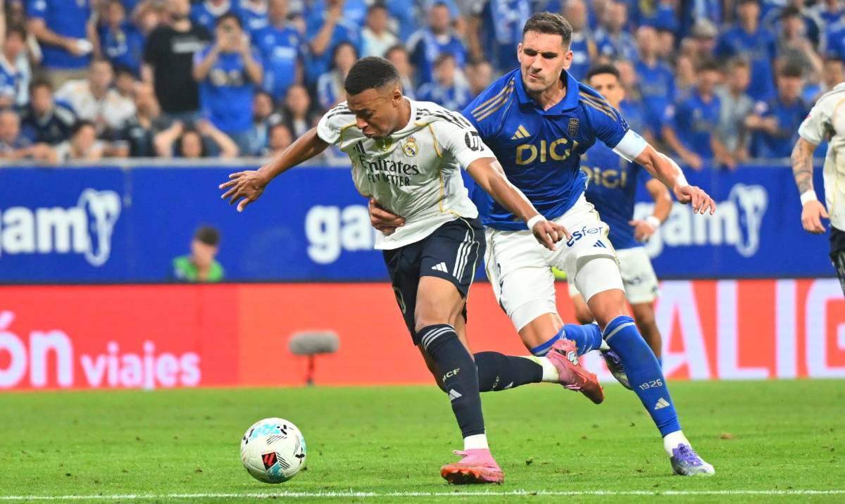 Oviedo's Dani Calvo, right, challenges Real Madrid's Kylian Mbappe during a Spanish La Liga soccer match between Real Oviedo and Real Madrid at Carlos Tartiere stadium in Oviedo, Spain, Sunday, Aug. 24, 2025. (AP)