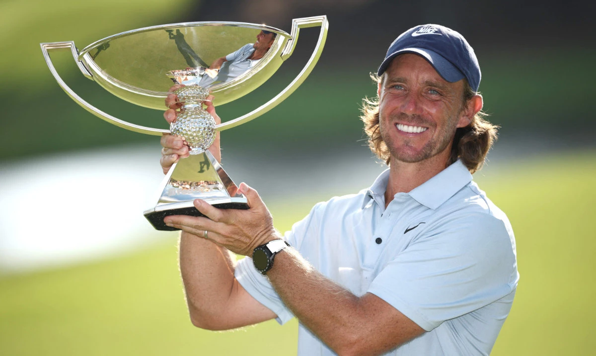 Tommy Fleetwood of England poses with the FedEx Cup trophy after winning the final round of the Tour Championship 2025 at East Lake Golf Club on Sunday in Atlanta, Georgia. (AFP)