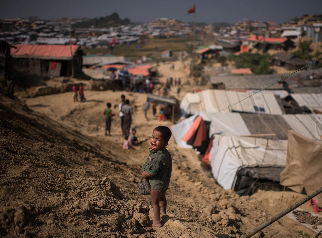 A photo dated 2017 shows a Rohingya Muslim refugee child cries as he stands near the Thyangkhali refugee camp at Cox's Bazar. (AFP)
