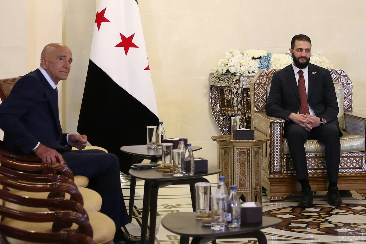 Syria's interim President Ahmad al-Sharaa (R) receives US Special Envoy to Syria Thomas Barrack, at the presidential palace in Damascus on July 9, 2025. (File/AFP)