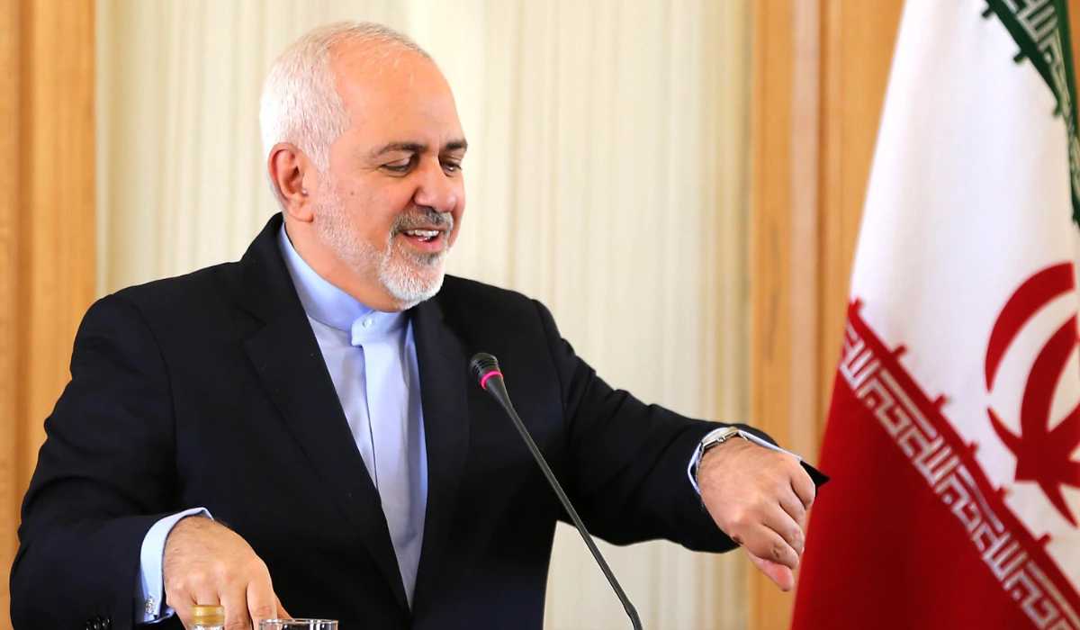This photo taken on Feb 13, 2019 shows Iran's FM Mohammad Zarif checks his watch during a press conference in Tehran. (AFP)