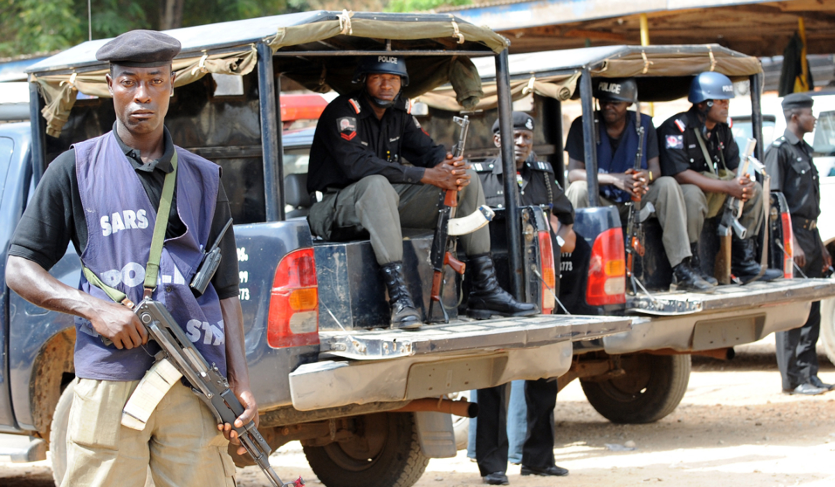 Policemen stand guard at the police headquarters in Jos. (AFP file photo)