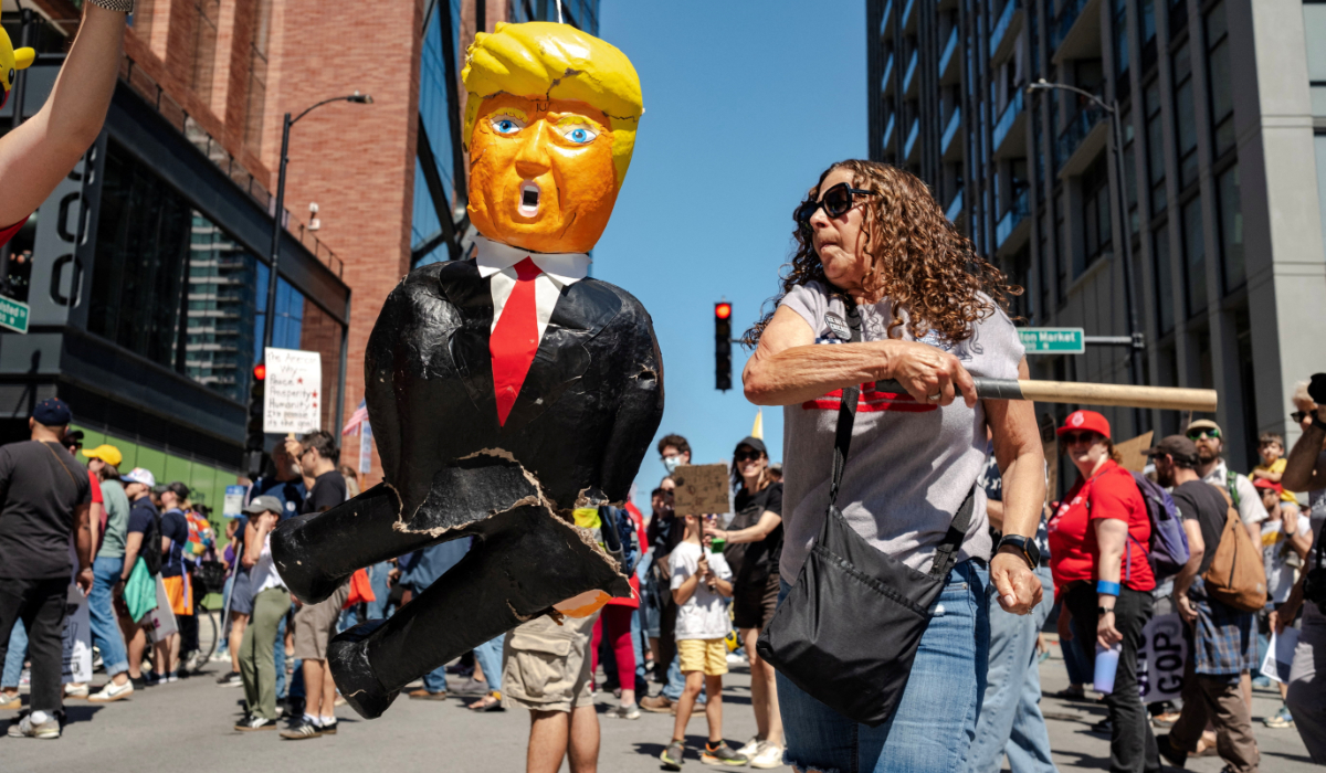 A person hits a pinata depicting U.S. President Donald Trump during a Labor Day protest in Chicago, Illinois, U.S., September 1, 2025. (REUTERS)