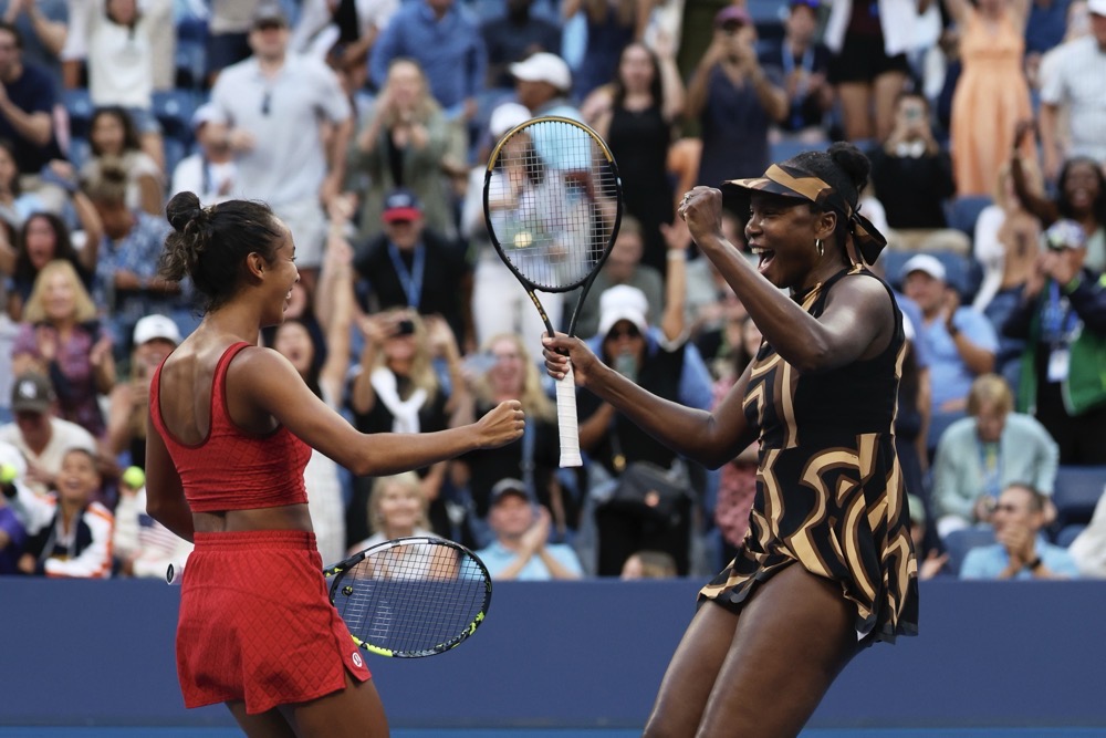 Leylah Fernandez, left, of Canada, and Venus Williams, of the United States, celebrate their third-round win. (AP)