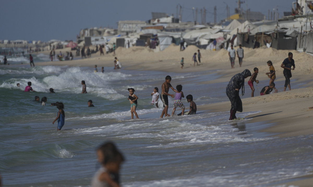 Palestinians cool off in the Mediterranean near a tent camp by the seaside in Khan Younis, southern Gaza Strip, Monday, Sept. 1, 2025. (AP)
