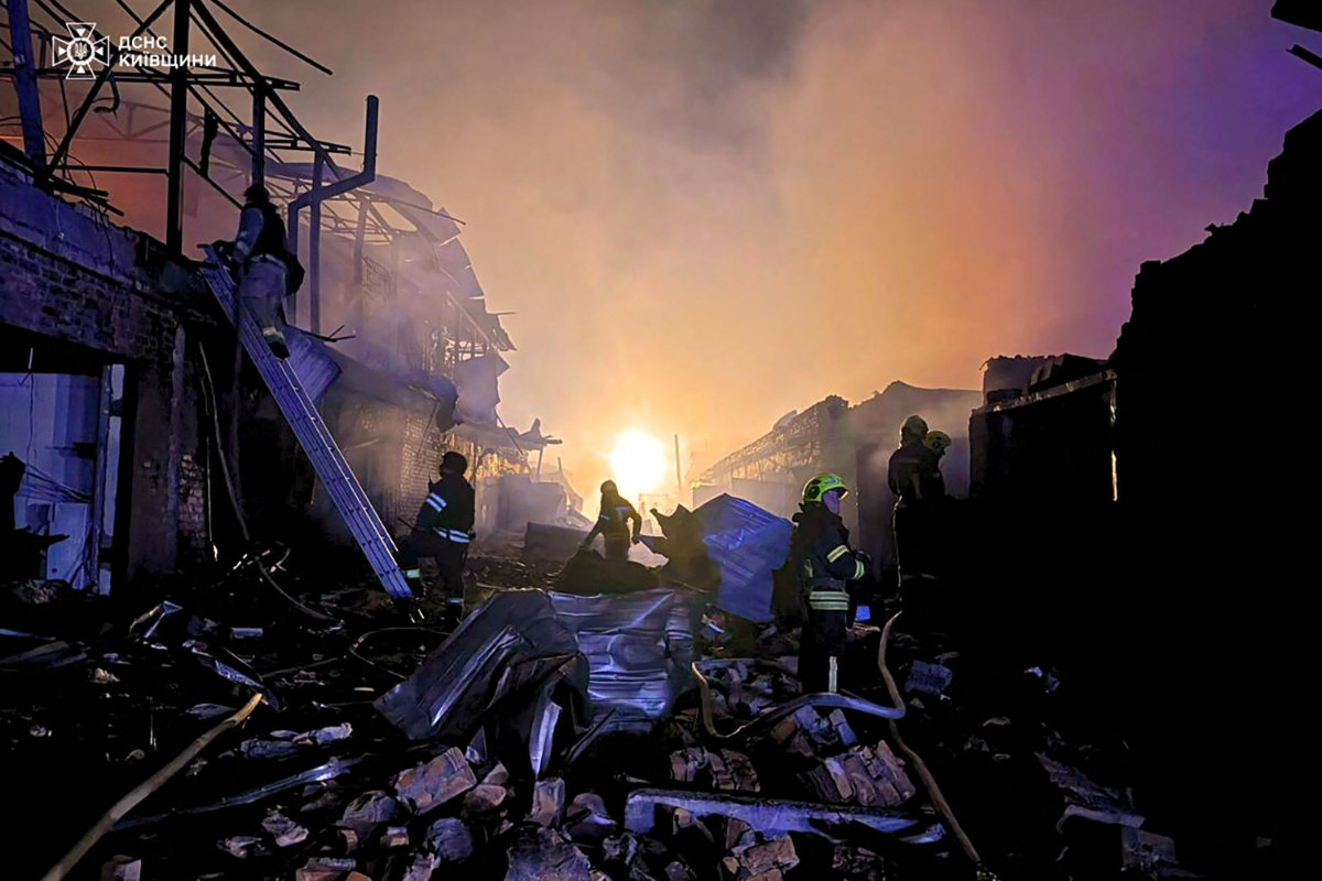 Ukrainian rescuers work to extinguish a fire at the site of an aerial attack in Bila Tserkva, Kyiv region, on September 3, 2025, amid the Russian invasion of Ukraine. (AFP)