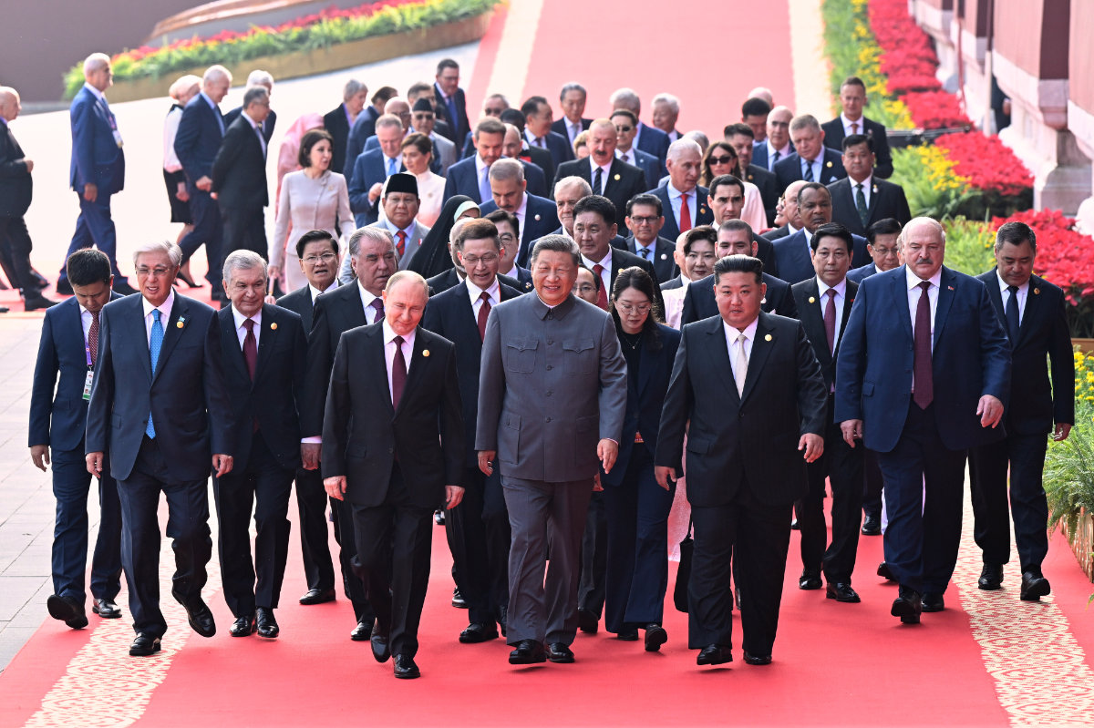 Chinese President Xi Jinping, center, and foreign leaders including Russia President Vladimir Putin, center left, and North Korean leader Kim Jong Un, center right, walk to Tiananmen Rostrum in Beijing on Sept. 3, 2025, ahead of a ceremony to commemorate the 80th anniversary of Japan's World War II surrender in Beijing. (Xinhua News Agency via AP)