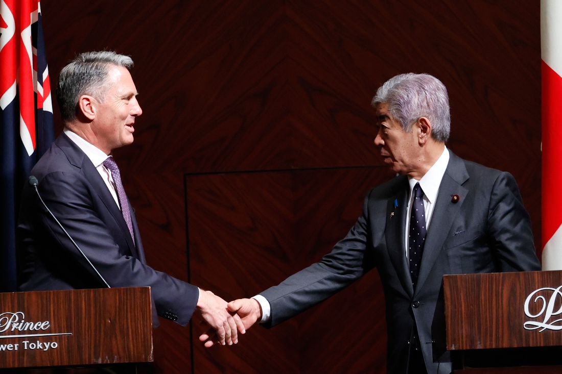 Australian Defense Minister Richard Marles and Japanese Foreign Minister Takeshi Iwaya shake hands at the conclusion of a joint press conference in Tokyo, Japan. (AP)