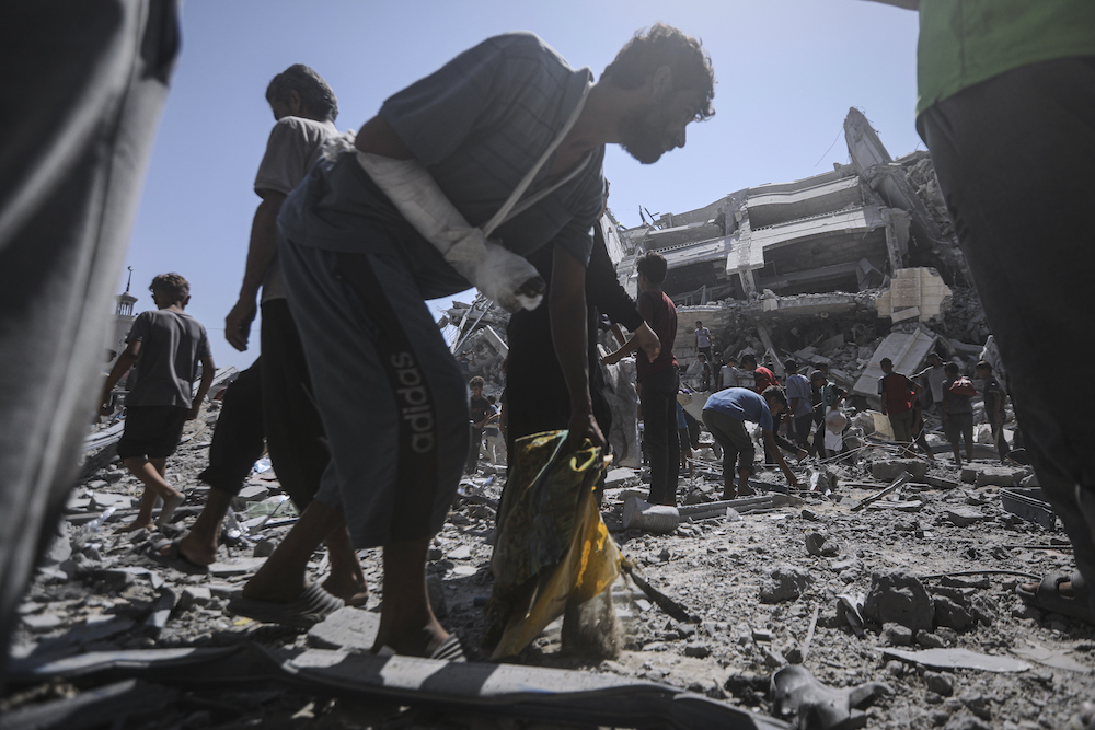 Palestinians inspect the damage after an Israeli army airstrike on a high-rise building in Gaza City, Friday, Sept. 5, 2025, after the Israeli army issued a prior warning. (AP)