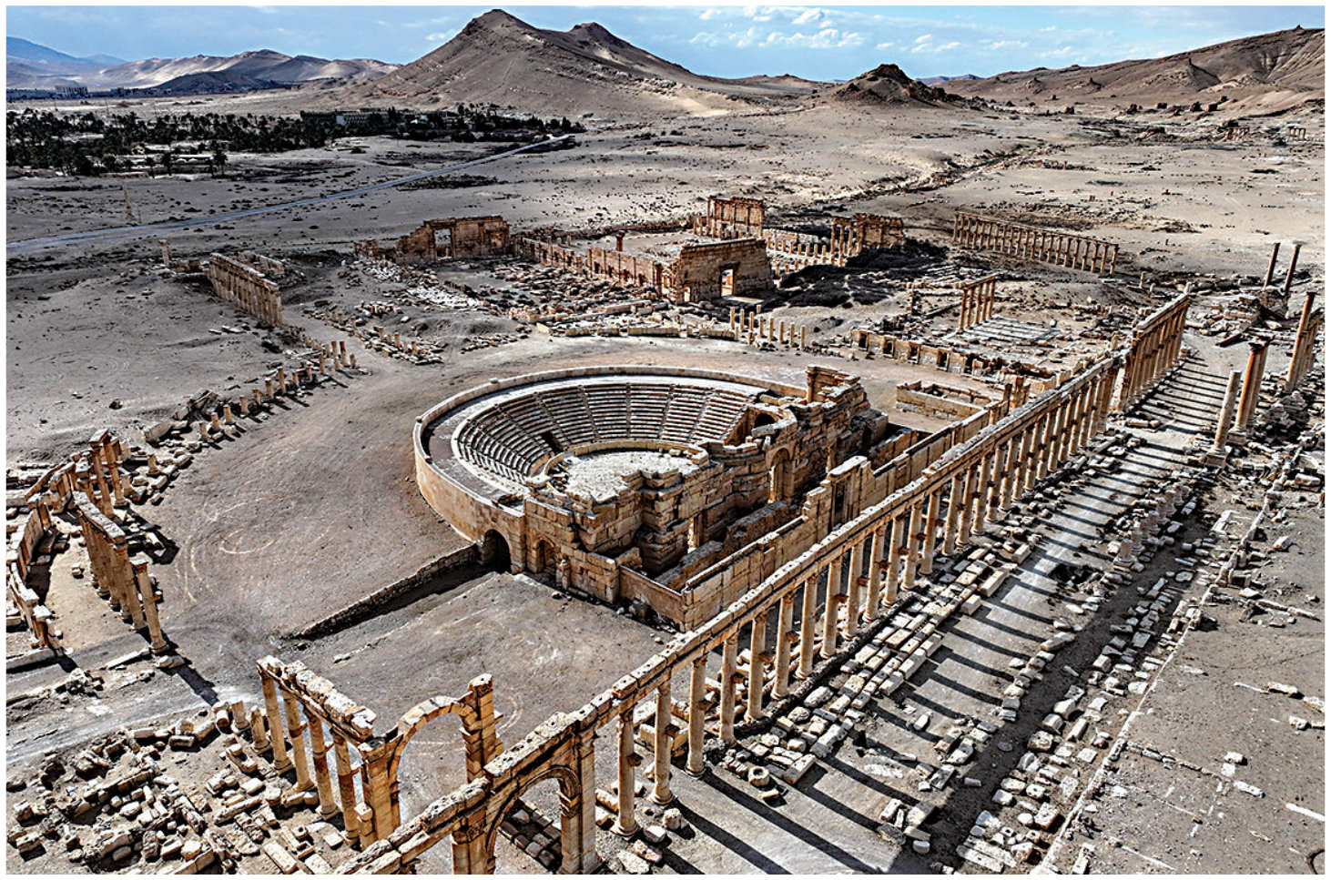 This aerial view shows the 2nd-century Roman amphitheater and the Great Colonnade (Decumanus Maximus) at the ancient ruins of Palmyra in central Syria on February 7, 2025. Palmyra is one of six Syrian sites listed on the UNESCO elite list of world heritage and all of them sustained some level of damage through out the 13-year civil war. (AFP)