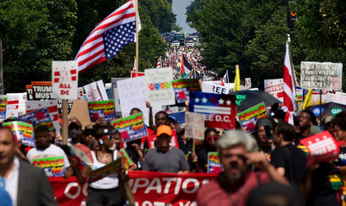 People participate in the "We Are All DC" national march in solidarity with DC communities and calling for an end to the deployment of National Guard troops in Washington, DC, on September 6, 2025. (AFP)