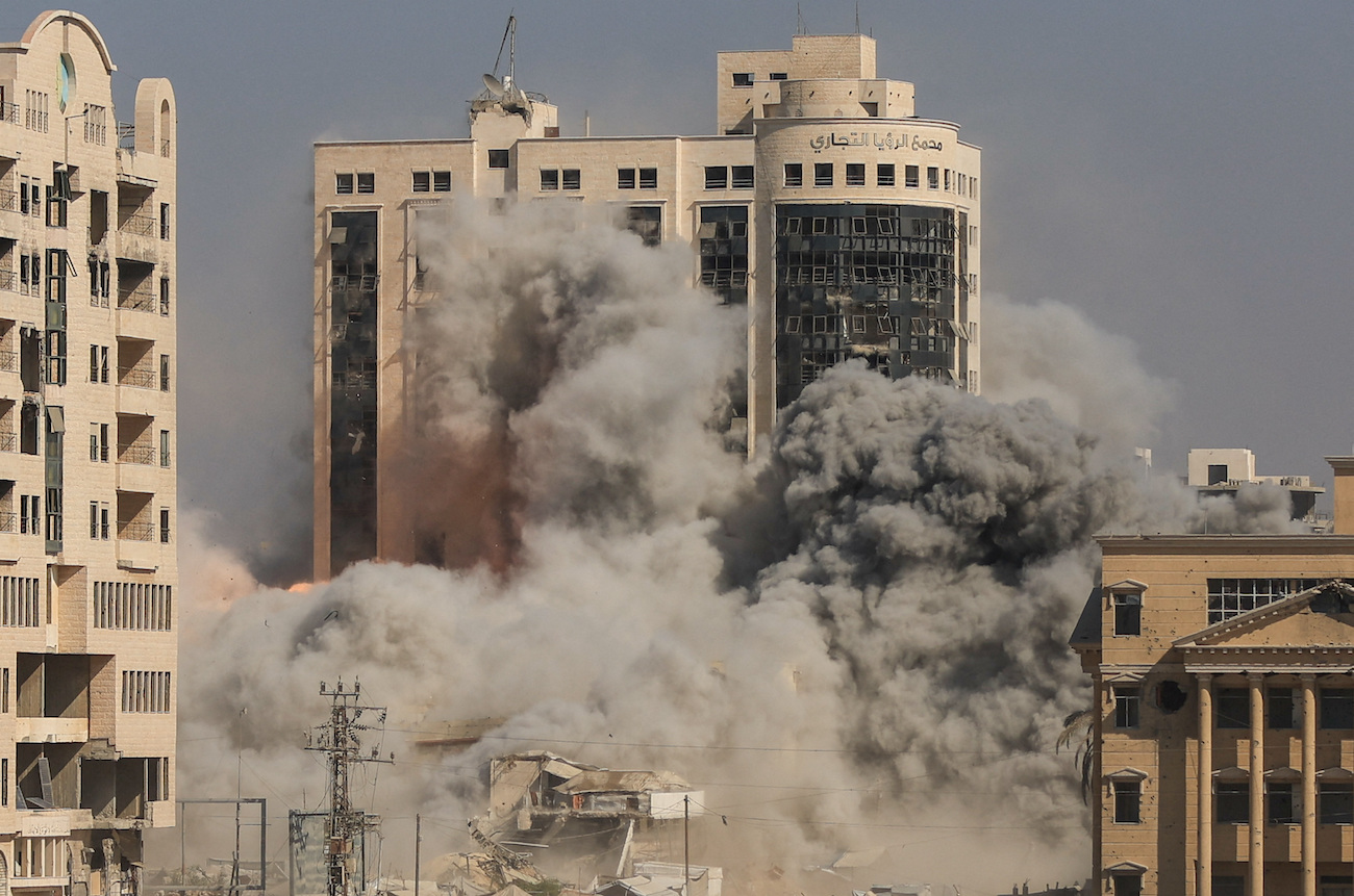 Smoke and flames rise as a residential building collapses after an Israeli air strike, in Gaza City, September 8, 2025. (Reuters)