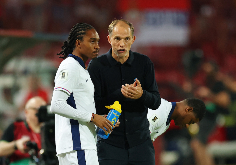 England manager Thomas Tuchel gives instructions to England's Djed Spence before he comes on as a substitute. (Action Images via Reuters)