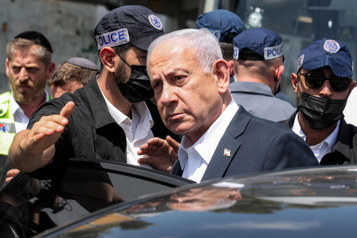 Israel's Prime Minister Benjamin Netanyahu visits the scene of a shooting at the Ramot road junction in Israeli-annexed east Jerusalem on September 8, 2025. On Tuesday, Israel launched an airstrike targeting Hamas political leaders in Qatar. (POOL / AFP)