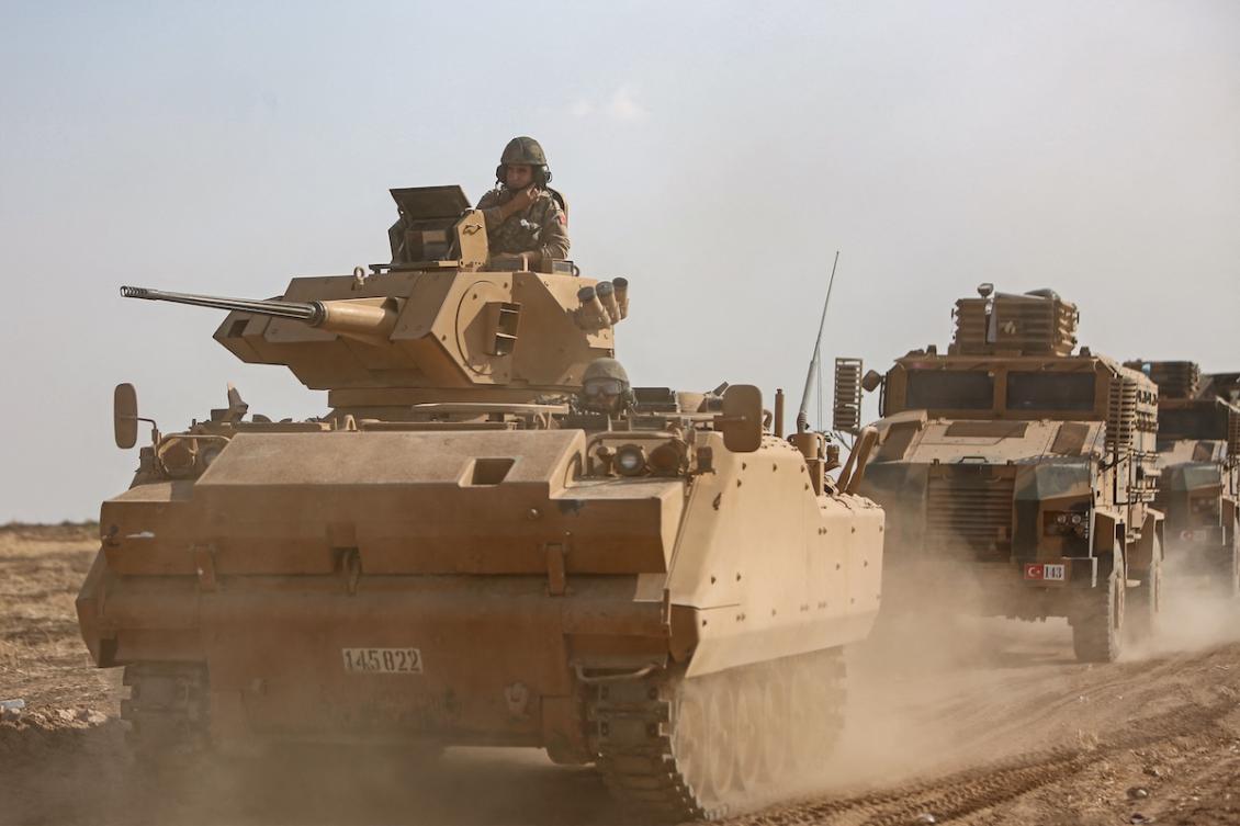 A Turkish armed forces convoy travels along the border between Syria and Turkey near the border town of Ras al-Ain in the Hassakeh province in northeastern Syria, on October 27, 2019. (FILE/AFP)