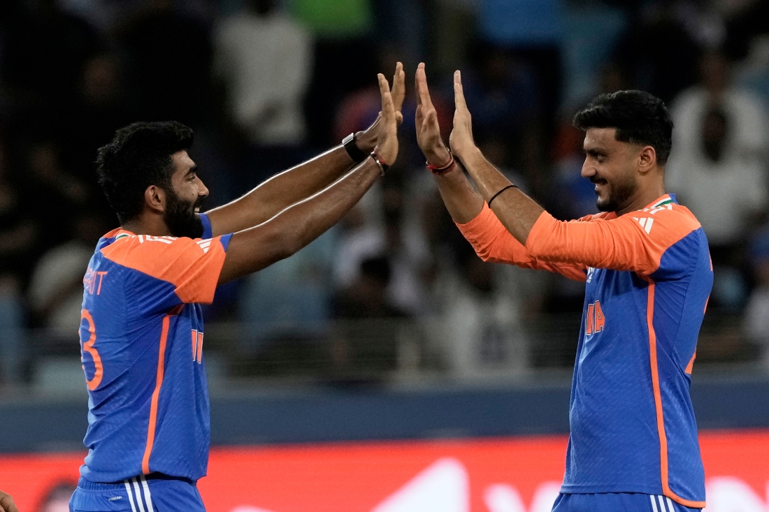 India’s Jasprit Bumrah, left, and India’s Axar Patel celebrate the wicket of United Arab Emirates’s Alishan Sharafu during the Asia Cup Cricket match between United Arab Emirates and India. (AP)