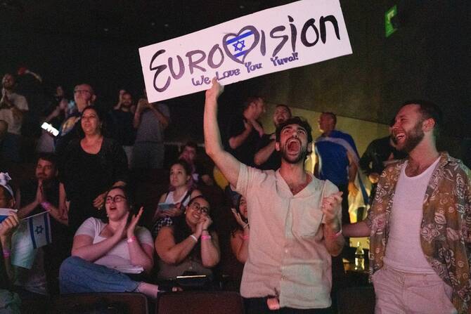 People react as they watch the votes being counted during the 2025 Eurovision Song Contest being screened at a community center in Tel Aviv, Israel, early on May 18, 2025. (AFP/File Photo)